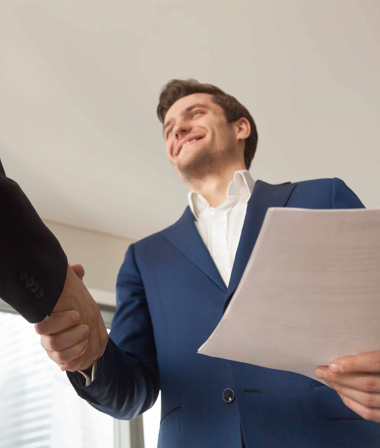 Smiling Company Manager Welcoming Client Office